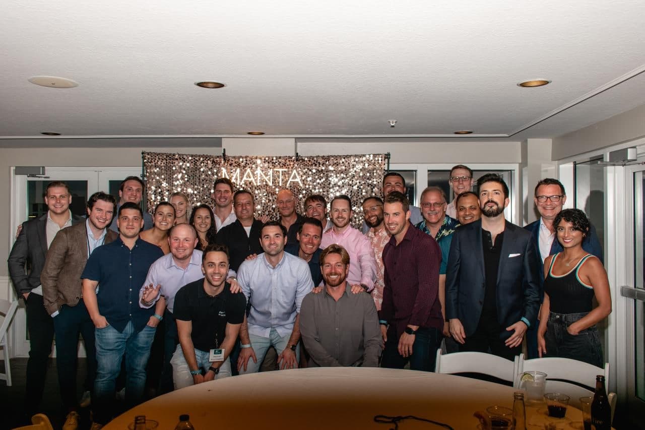 Kason with colleagues at a MANTA company event